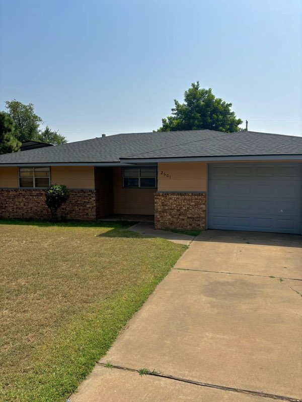 Finished dark shingle roof on an Enid home by Vargas Roofing